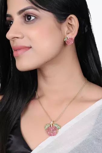 Women gold-plated stone studded pendent and earrings set