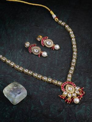 Women gold plated stone studded pearl tessel necklace and earrings 1