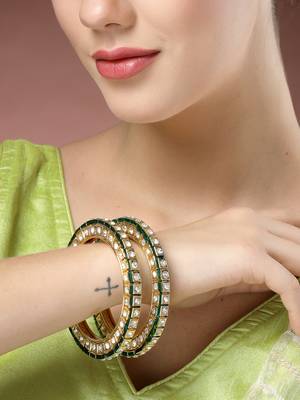 gold alloy bangles with kundan studded work 1