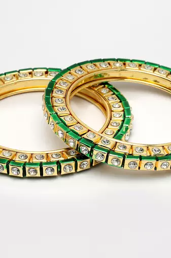 gold alloy bangles with kundan studded work
