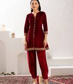 Aask women solid velvet lace work maroon color kurta & pant set