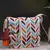 geomat natural & multi chevron printed polycotton sling bag