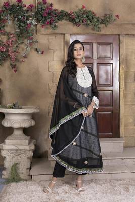 Nikhaar black embroidered georgette asymmetrical kurta & pants set 1