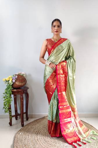 Green woven aura cotton kanjivaram silk blend Saree with blouse piece