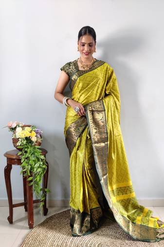Green woven aura cotton kanjivaram silk blend Saree with blouse piece