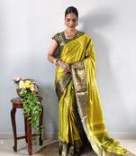 Green woven aura cotton kanjivaram silk blend Saree with blouse piece