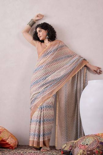 women off white linen ikat printed saree