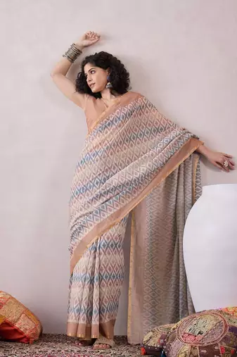 women off white linen ikat printed saree