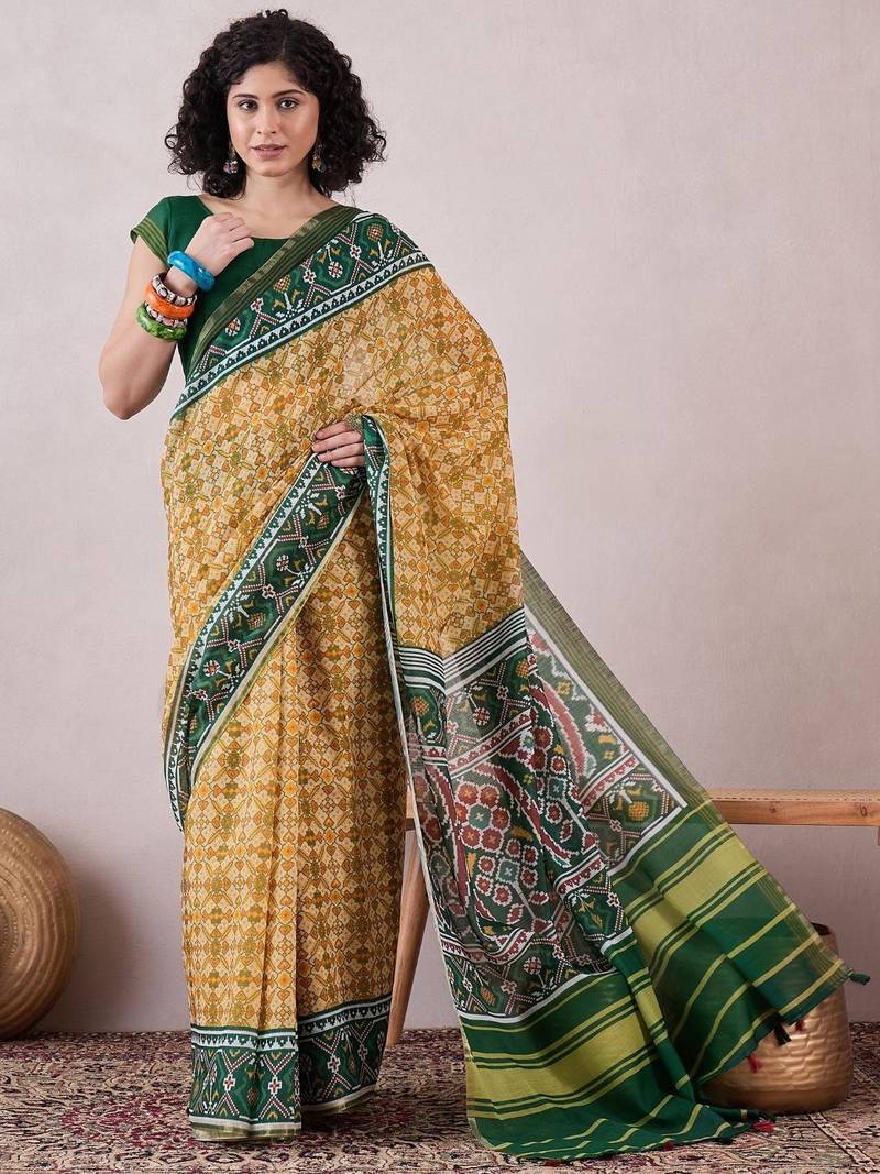 women cream linen patola printed saree