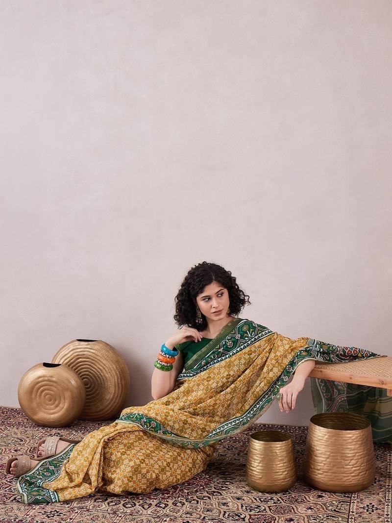 women cream linen patola printed saree