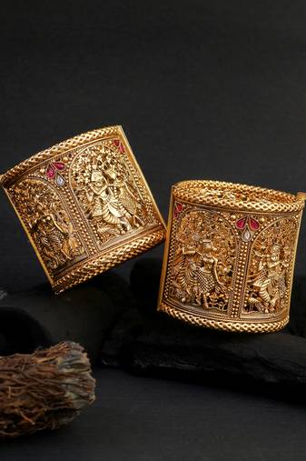 Women gold-plated temple design stone studded broad bangles