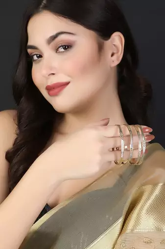 Women gold-plated traditional self design set of four bangles