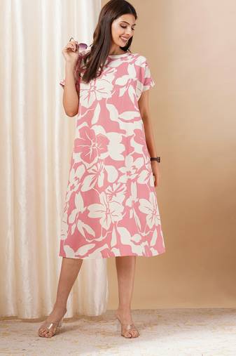 Pink printed cotton dress with hand embroidery and pocket.