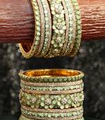 Women gold plated green stone studded flower design bangles