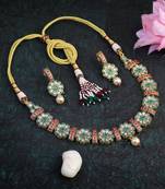 Women gold plated stone studded pearl tessel necklace and earrings