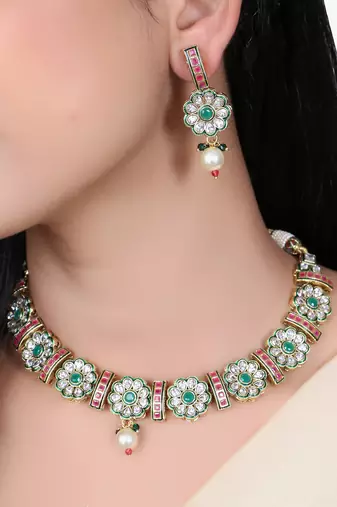 Women gold plated stone studded pearl tessel necklace and earrings