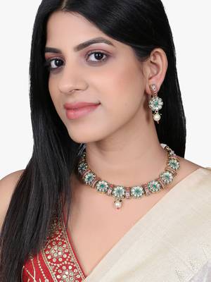 Women gold plated stone studded pearl tessel necklace and earrings 5