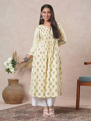 A flared cotton kurta  with embroidered neckline and blend of two different prints. 1