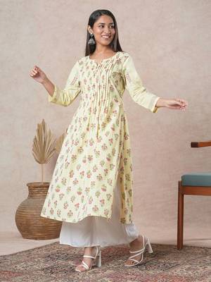 A flared cotton kurta  with embroidered neckline and blend of two different prints. 3