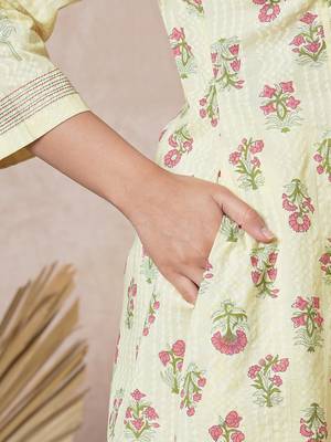 A flared cotton kurta  with embroidered neckline and blend of two different prints. 5