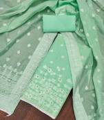 Green color weaving work banarasi cotton unstitched dress material