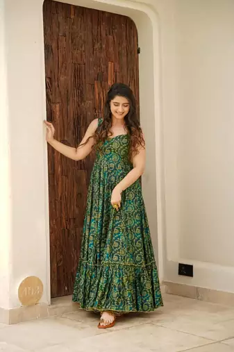 Green colour beautiful rayon partywear long gown for trendy looks wedding ceremony