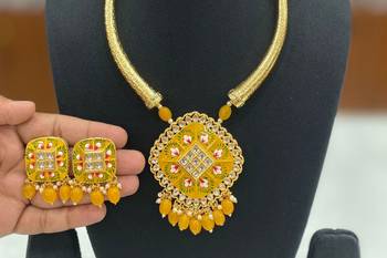 Hasli necklace set with matching earrings meenakari work, kundan stones, gold polish, adjustable drawstring 1