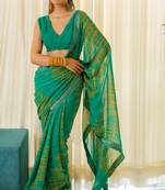 Teal Georgette Abstract Print Lace Border Saree With Unstitched Blouse Piece