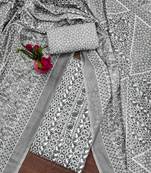 Women's grey fancy print work with thread embrodered neck tie along with designer printed dress material