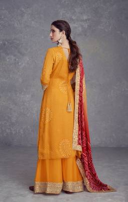 Yellow heavy gota & mirrow wrok bandhani silk suits 4