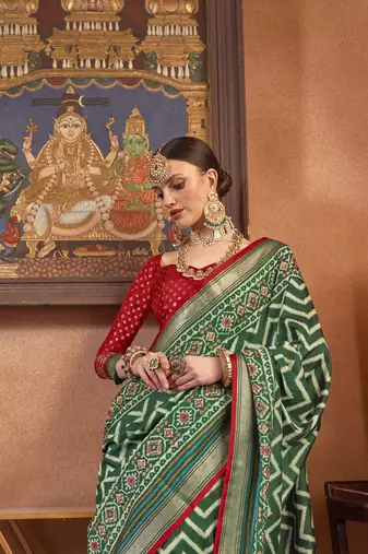 Green silk blend Blend Patola Saree With Unstitched Blouse Piece