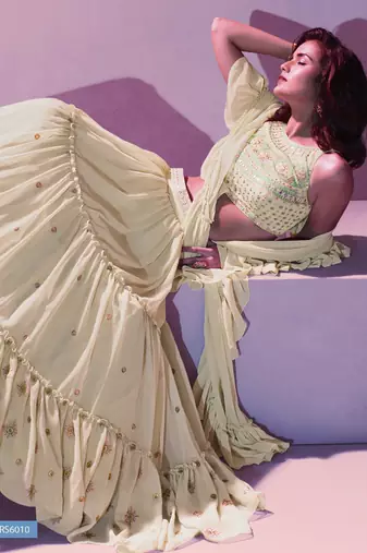 Cream ruffle lehenga choli with  dupatta and belt