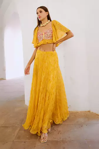 Gulbahar marigold yellow  jugnu sitara butterfly blouse with flair skirt set.