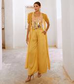 Marigold yellow tussar silk sheesha koti with chiffon jacket and loose pant set.