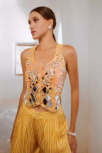 Marigold yellow tussar silk sheesha koti & loose pant set.