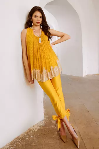 Marigold yellow chiffon cutdana tunic with bow pant set