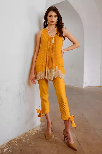 Marigold yellow chiffon cutdana tunic with bow pant set