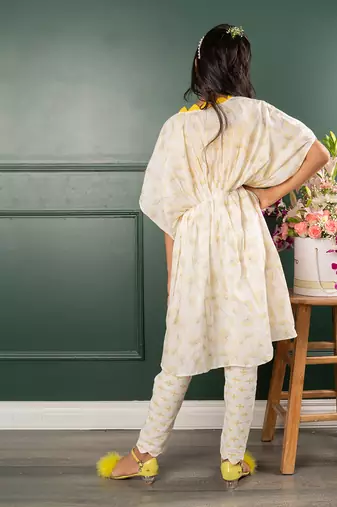 Yellow and white straps top and bird embroidered tie up white jacket and scalloped hem pant
