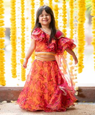 Orange and pink organza printed floral lehenga with one-shoulder blouse 1