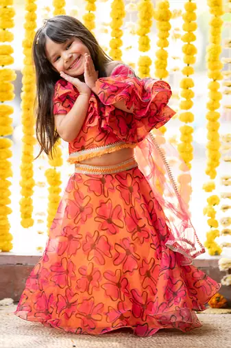 Orange and pink organza printed floral lehenga with one-shoulder blouse