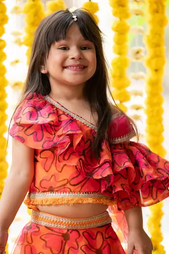 Orange and pink organza printed floral lehenga with one-shoulder blouse