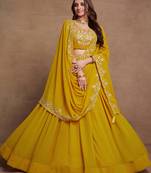 Yellow Sequined Embroidered work Faux Georgette Fabric Flared Lehenga Choli with Dupatta.