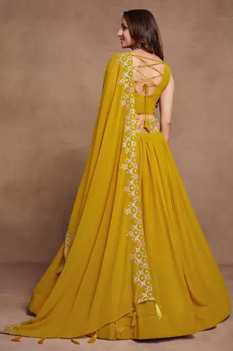 Yellow Sequined Embroidered work Faux Georgette Fabric Flared Lehenga Choli with Dupatta.