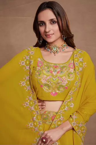 Yellow Sequined Embroidered work Faux Georgette Fabric Flared Lehenga Choli with Dupatta.