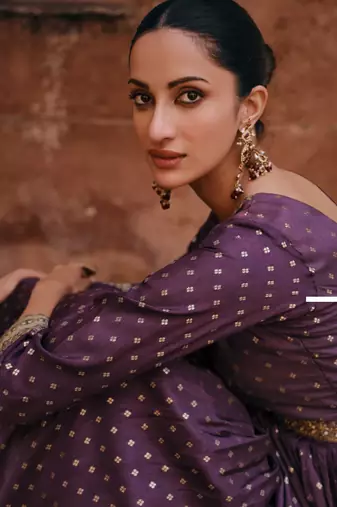 Purple embroidered jacquared silk free size stitched gown. (size upto 42)