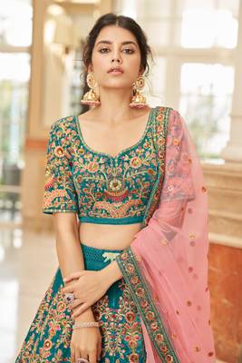 Alluring Teal Blue Thread Zari Dori And Sequins Embroidered Velvet Bridal Wear Lehenga Choli For Women 3