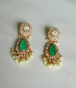 Sophisticated kundan jadau earrings with green doublet stone