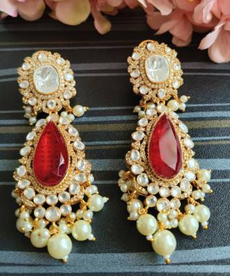 Sophisticated kundan jadau earrings with red doublet stone 3