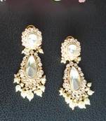 Sophisticated kundan jadau earrings with white doublet stone