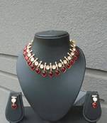 Kundan necklace set with red semiprecious stones